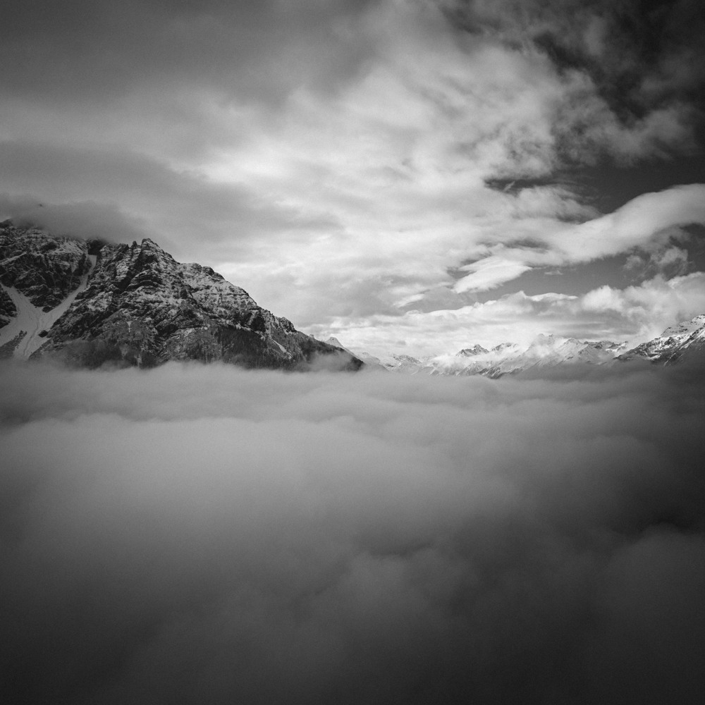 Snowy mountains covered in clouds