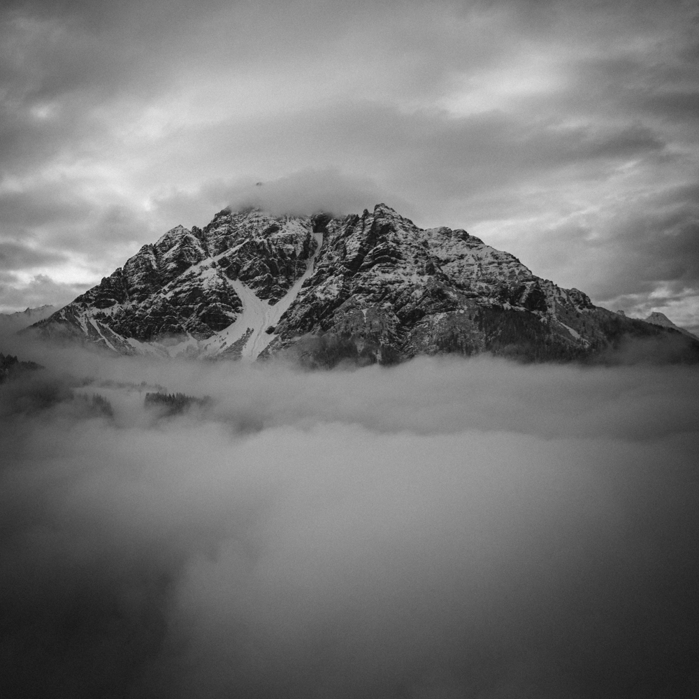 Snowy mountains covered in clouds