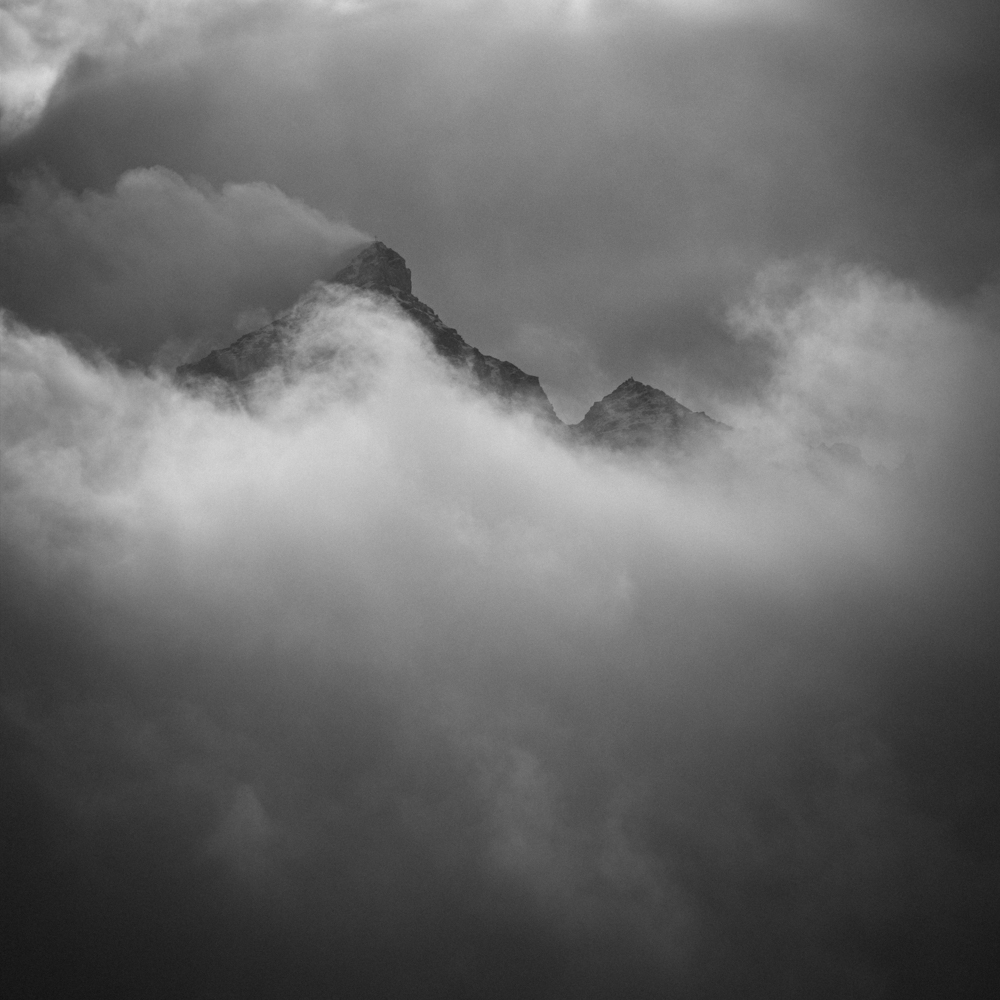 Snowy mountains covered in clouds